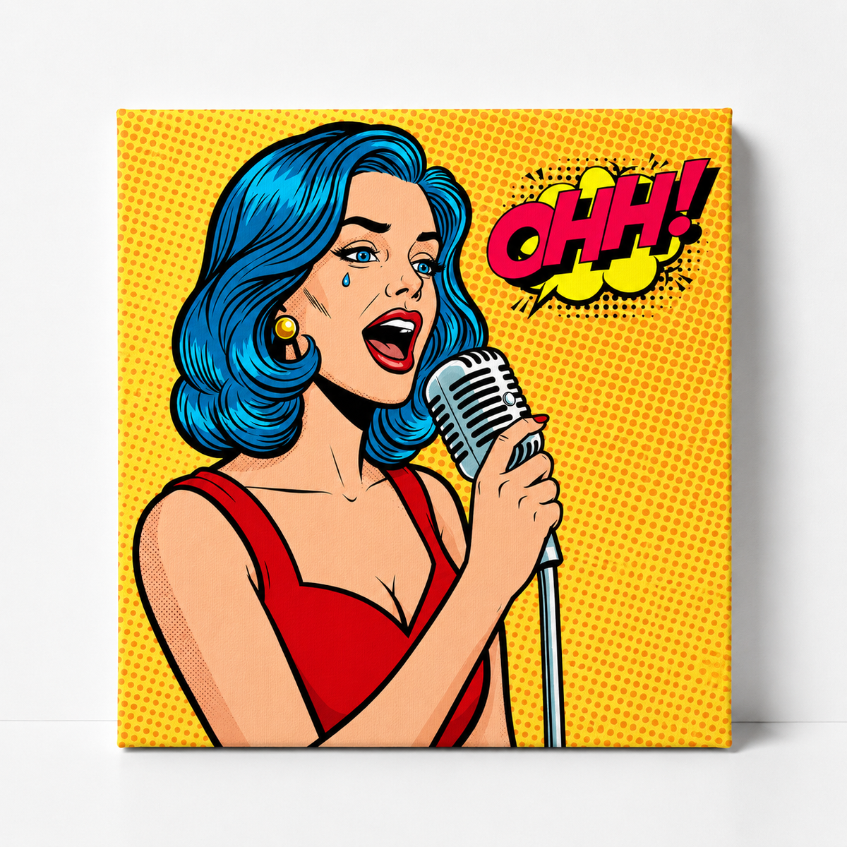 A square canvas wall art print featuring a retro comic-style illustration of a woman with bright blue hair singing into a microphone, set against a yellow halftone background with a red 'OHH!' speech bubble. The canvas is shown hanging on a light gray wall.