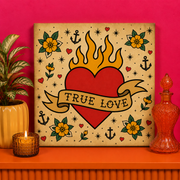 True Love Heart Bedazzle Kit featuring a traditional tattoo-style flaming heart with banner, flowers and vintage tattoo flash details on a 20x20cm DIY rhinestone art canvas.